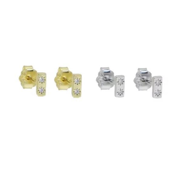 Pair of gold and silver stud earrings with small diamonds on a white background