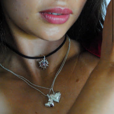 heart gem with flames around it on a suede cord necklace handmade on the gold coast