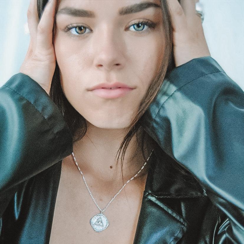 girl wearing eveil eye protection necklace