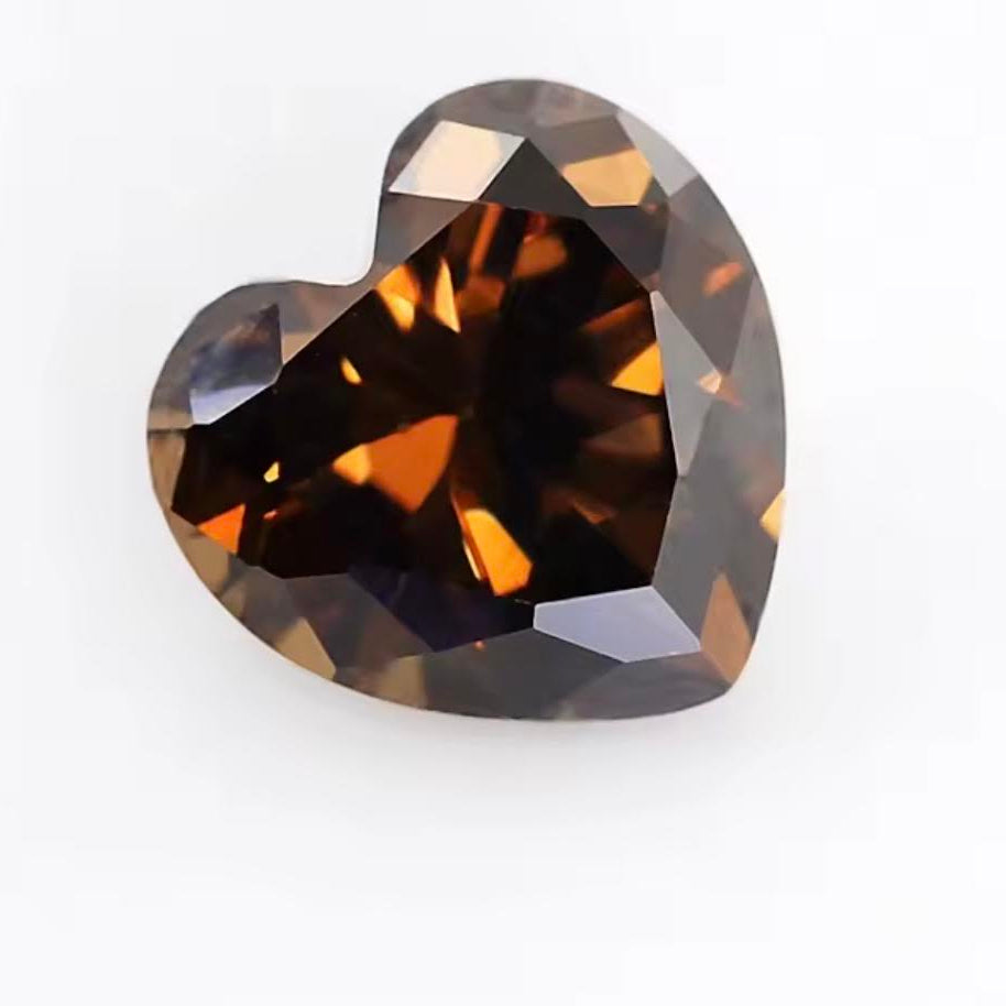 Heart-shaped brown gemstone on a white background