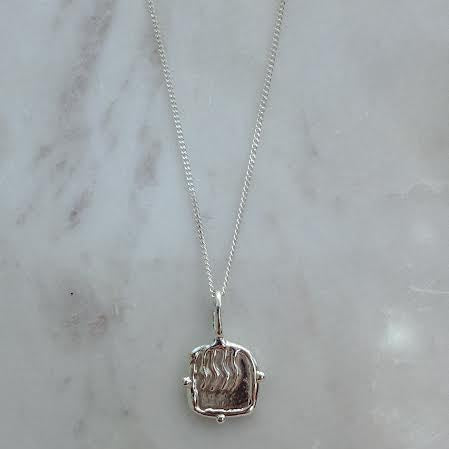 fire element necklace in silver also represents zodiacs