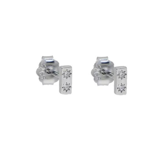 Pair of silver earrings with gemstones on a white background