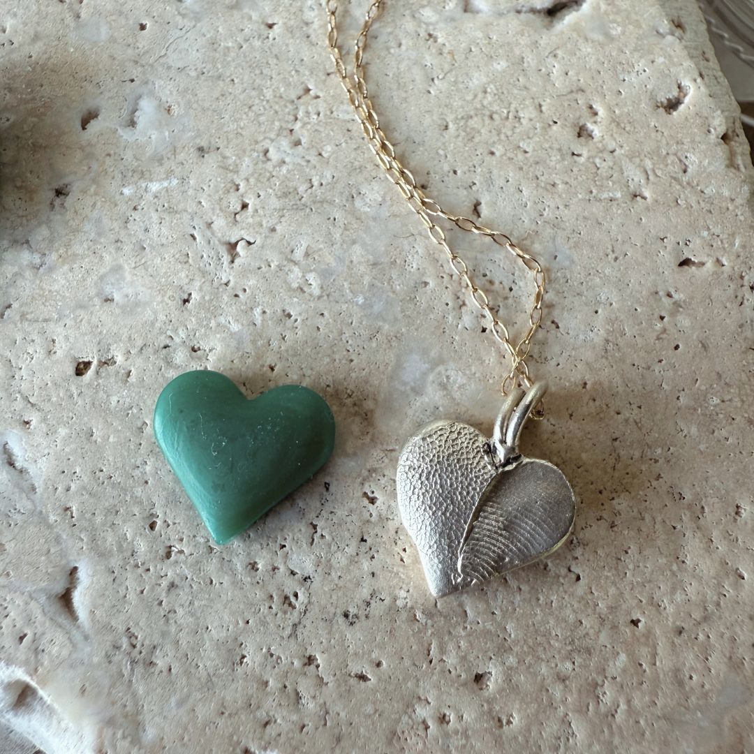 small silver pendant heart shapped with pet print