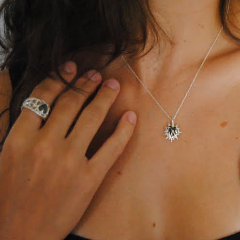 beautiful 1cm black or ruby heart shaped gem with handmade silver flame and spikes around the gem on a thin silver chain