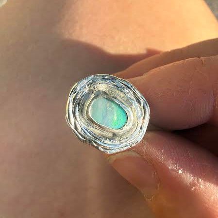 silver ring with opal in the centre